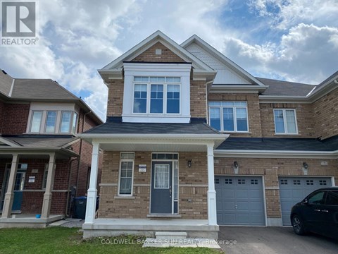 A house with a realtor logo in the corner.