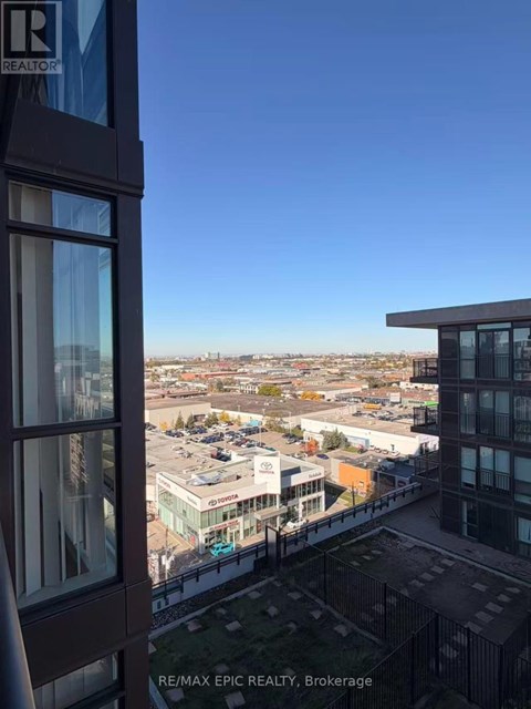 A view from a high-rise building looking out over a cityscape.