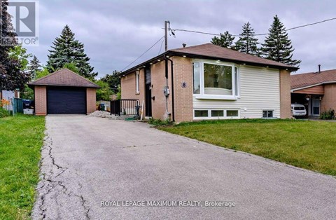 A house with a driveway in front of it.