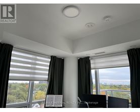 A room with a sign that says "REALTOR" on the wall.