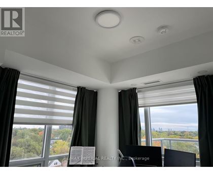 A room with a sign that says "REALTOR" on the wall.