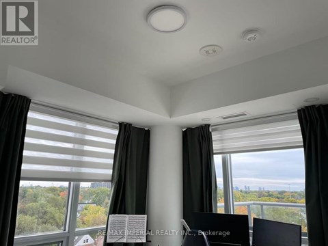 A room with a sign that says "REALTOR" on the wall.