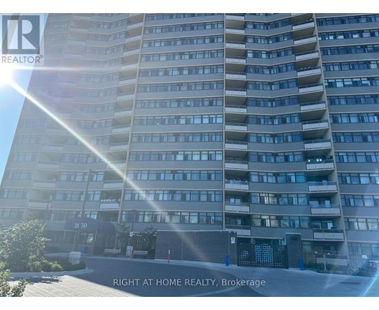 A tall residential building with the sun shining on it.