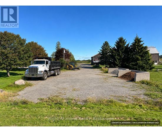 A gravel driveway leads to a house with a truck parked in front.