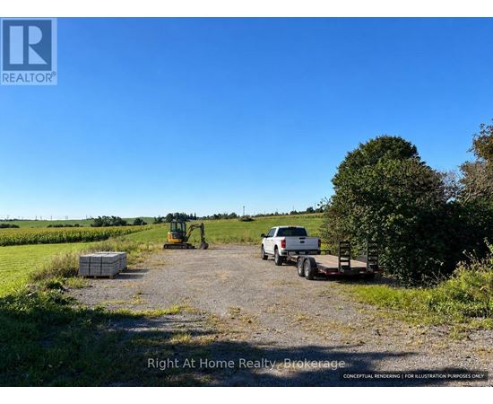 A dirt road with a white truck and a yellow tractor.