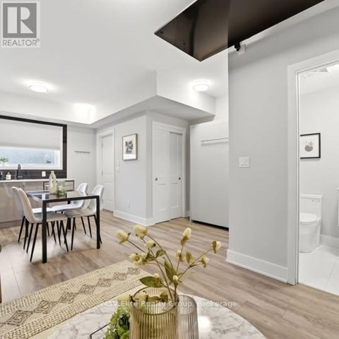 A well-lit, modern kitchen with a dining table and chairs.
