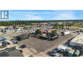 A large outdoor parking lot with a building in the background.