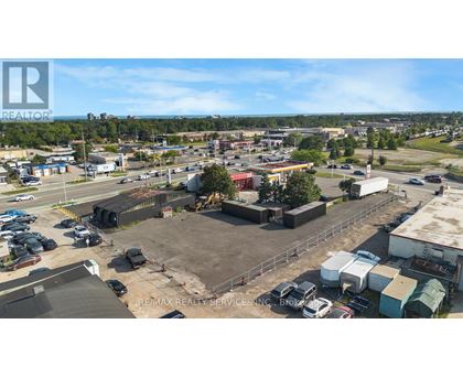 A large outdoor parking lot with a building in the background.