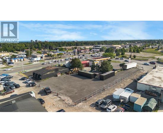 A large outdoor parking lot with a building in the background.