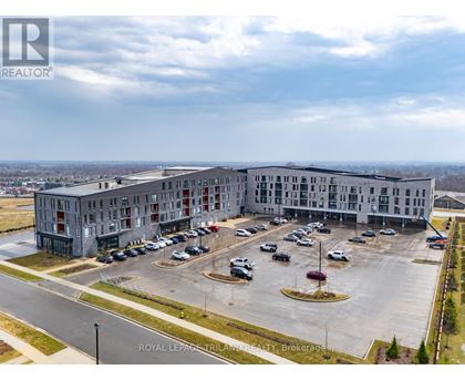 A large building with a parking lot in front of it.