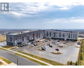 A large building with a parking lot in front of it.