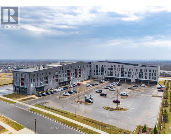 A large building with a parking lot in front of it.