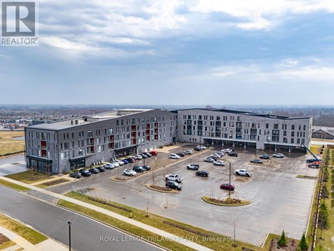 A large building with a parking lot in front of it.