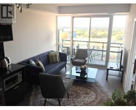 A living room with a sofa, chairs, and a coffee table.
