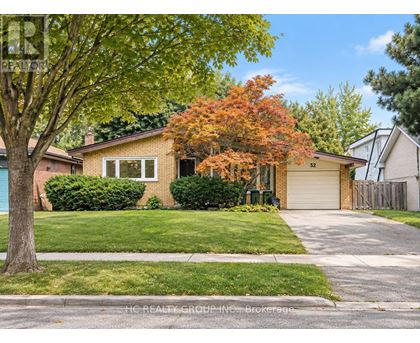 A house with a tree in front of it.