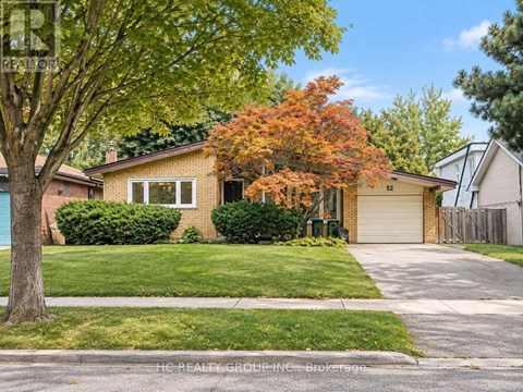A house with a tree in front of it.