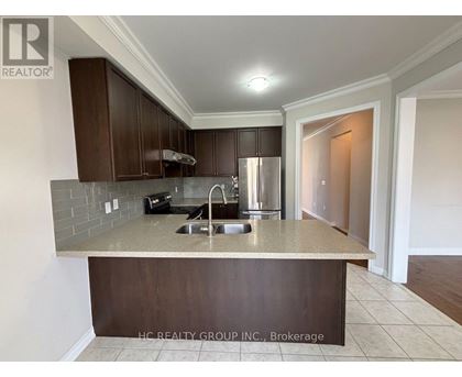 A kitchen with a sink and a counter.