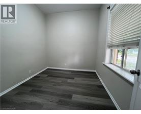 A room with a window and a door.