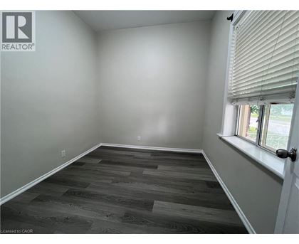 A room with a window and a door.