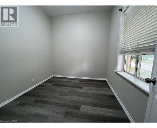 A room with a window and a door.