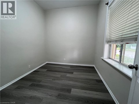 A room with a window and a door.