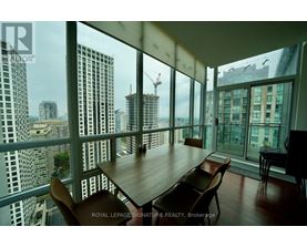 A dining room with a view of the cityscape.