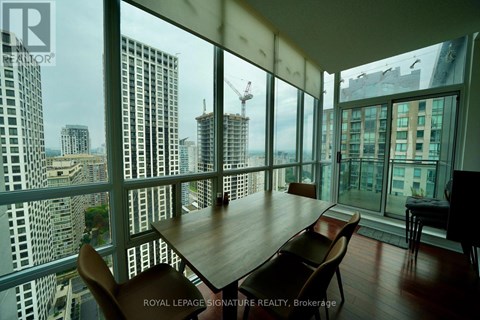 A dining room with a view of the cityscape.