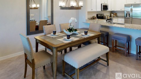 A dining room with a wooden table and chairs.