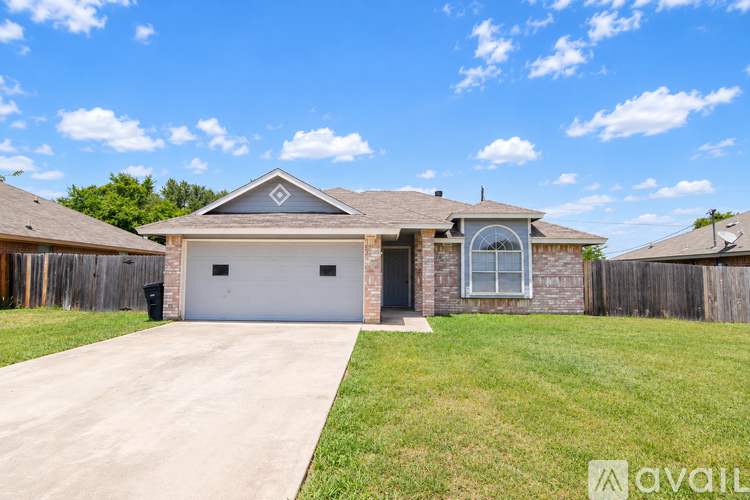 A house with a garage is available for sale.