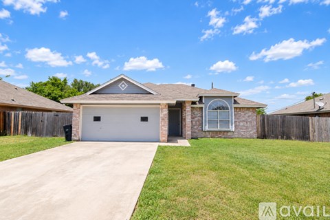 A house with a garage is available for sale.