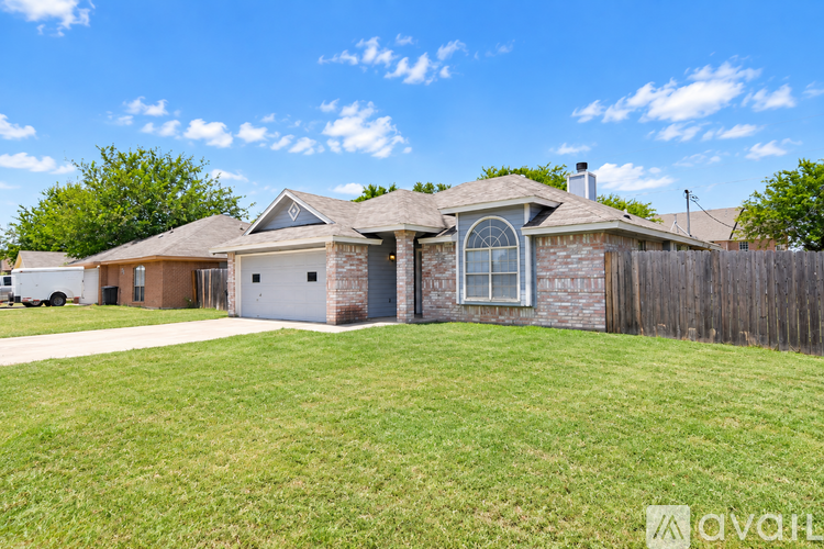 A house with a large front yard is for sale.