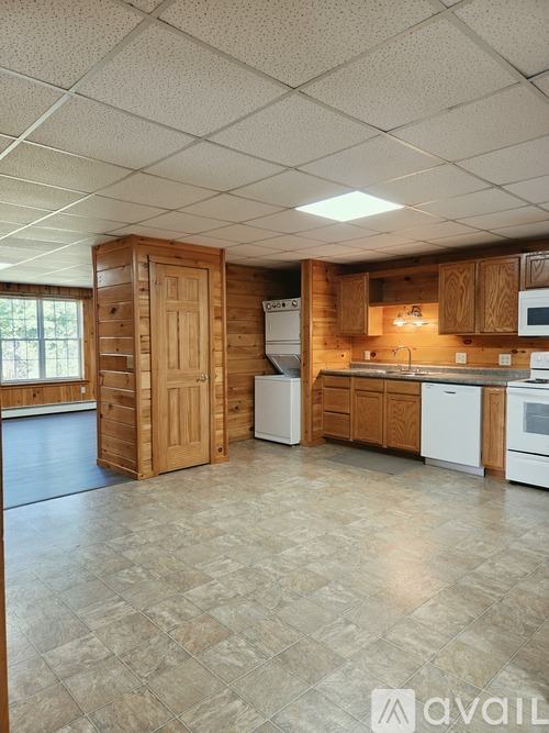 A room with wooden walls and a window.