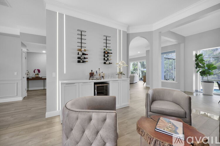 A living room with a grey sofa and a wooden coffee table.