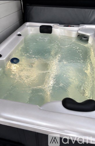 A hot tub with water in it.