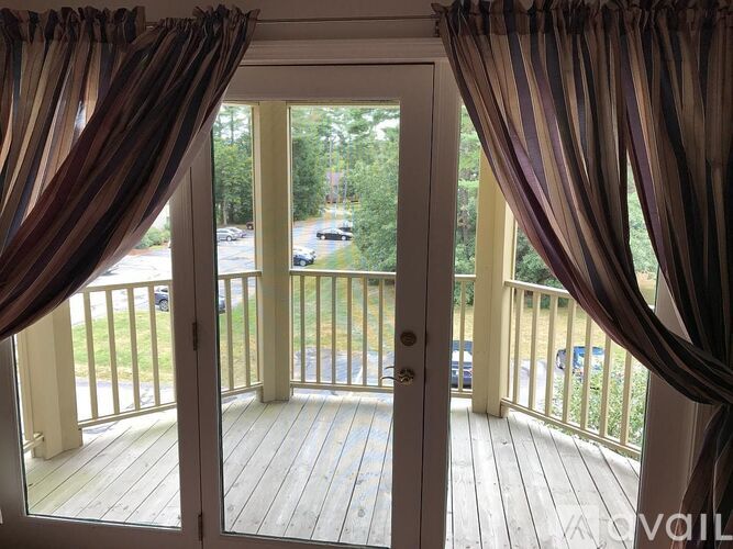 A view from a doorway looking out to a street.