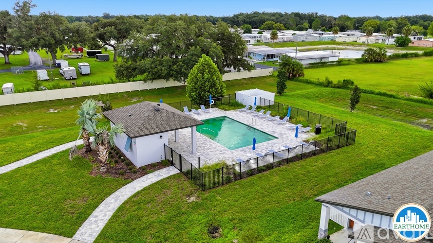 A house with a pool in the backyard.