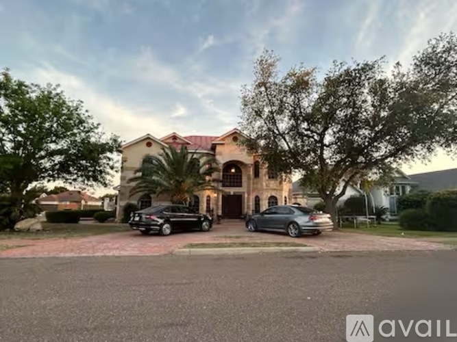 A house with a car parked in front of it.