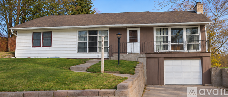 A house with a garage is for sale.