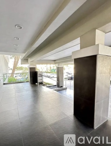 A hallway with a tiled floor and a modern design.