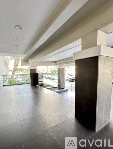 A hallway with a tiled floor and a modern design.