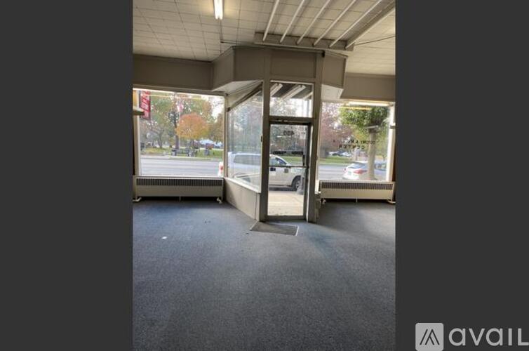 A car dealership with a closed glass door.