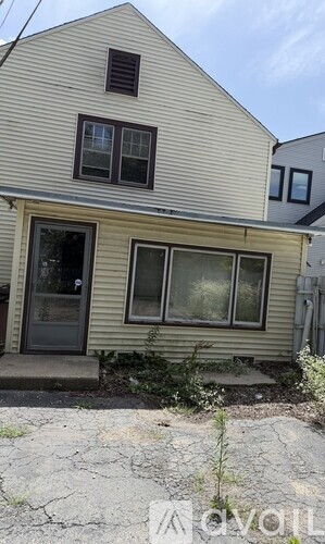 A house with a grey door and windows.