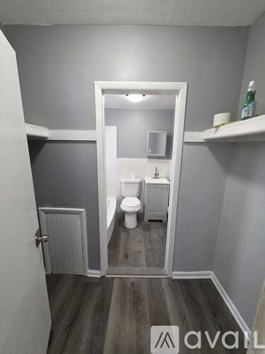 A small bathroom with a toilet and a sink.