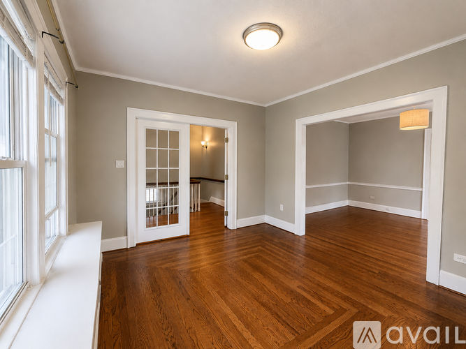 A room with wooden floors and white walls.