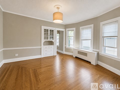 A room with wooden floors and white walls.