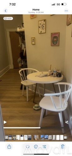 A white table and chair set in a room.