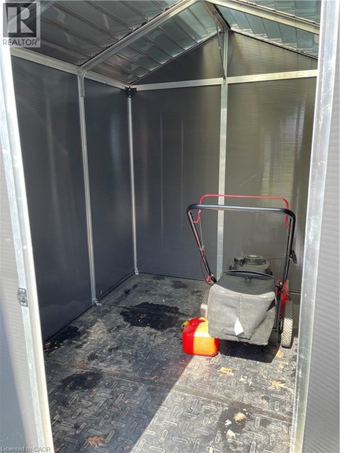 A cleaning machine is inside a room with a glass ceiling.