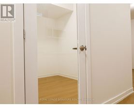 A white door with a Royal LePage Signature Realty logo on it.