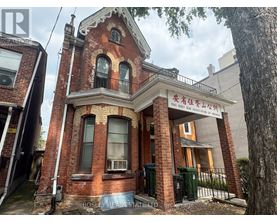 A red brick building with a sign that reads "Bosley Real Estate".