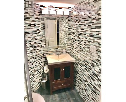 A bathroom with a sink and a mirror.